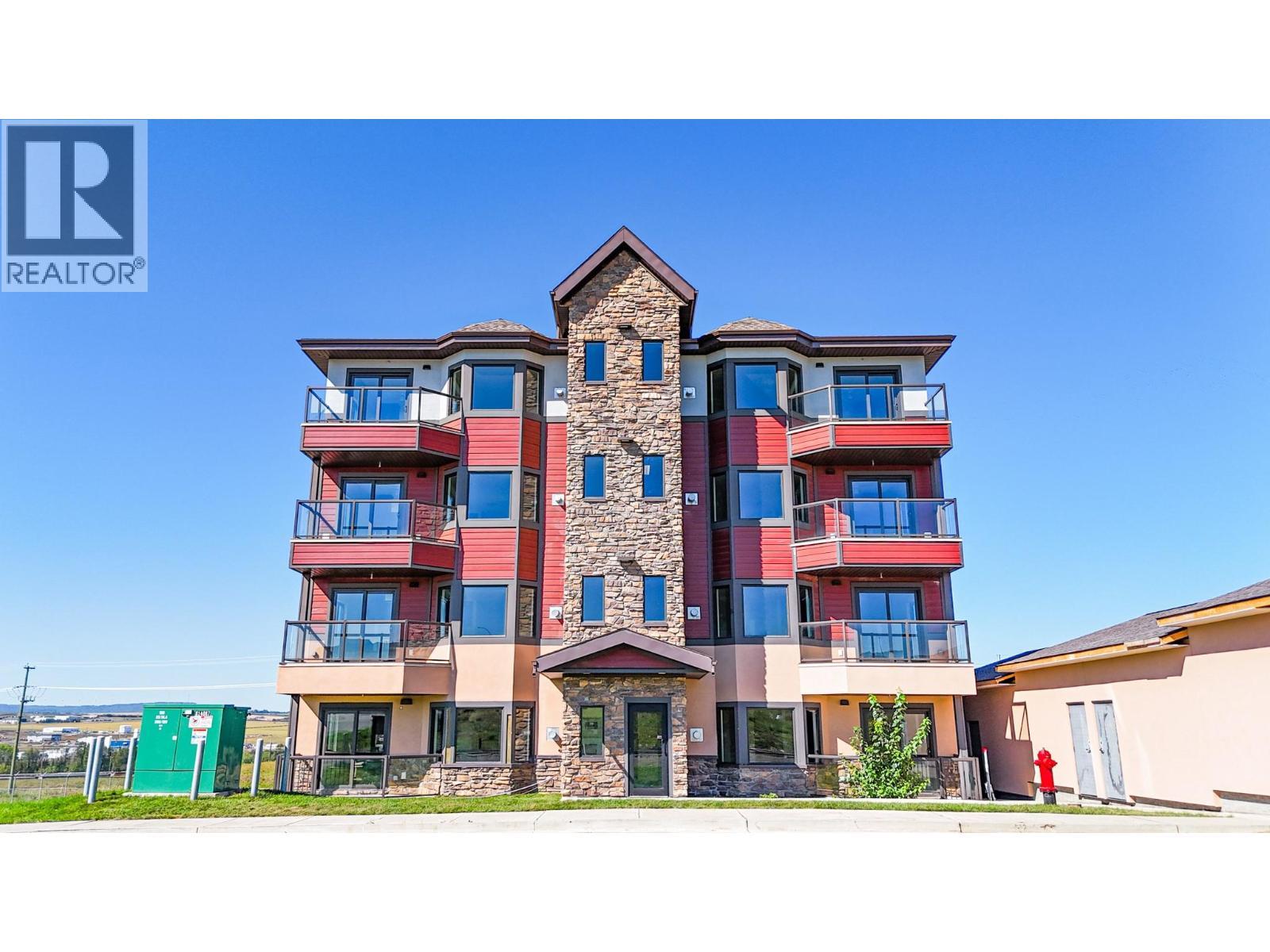 2032 86 Avenue Unit# 1101, Dawson Creek, BC - Outdoor With Balcony With Facade