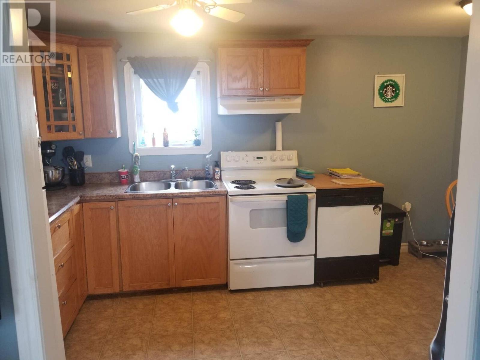 16 Currie Avenue, Channel-Port Aux Basques, NL - Indoor Photo Showing Kitchen With Double Sink