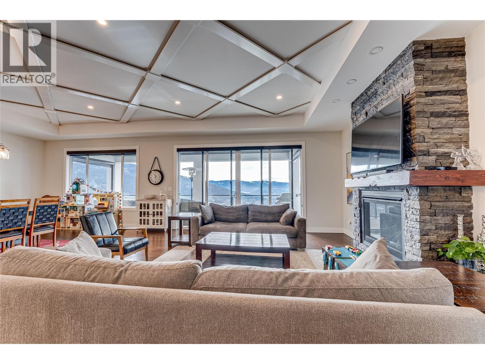 7429 Sun Peaks Drive, Vernon, BC - Indoor Photo Showing Living Room With Fireplace