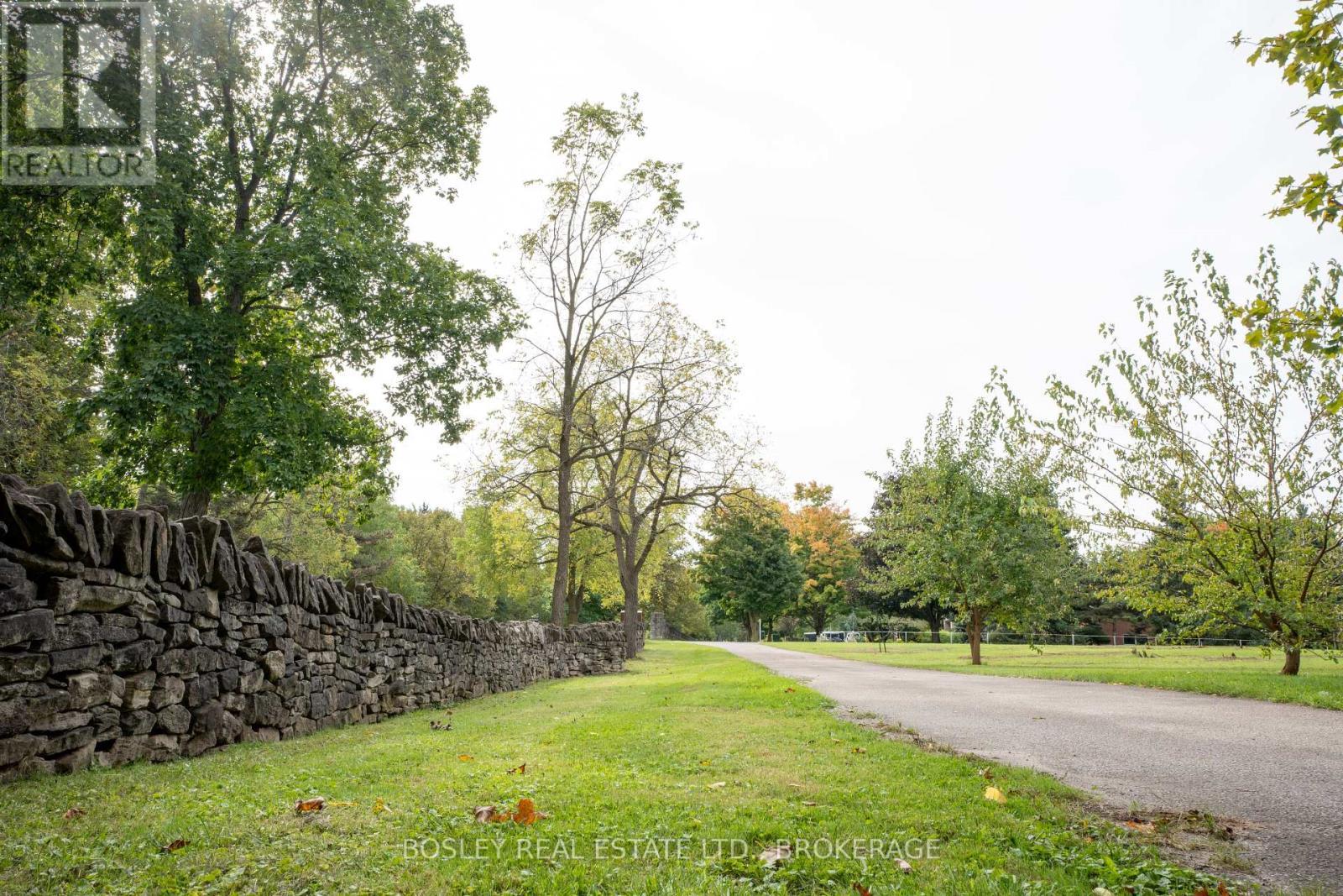 HISTORIC STONE WALL TO THE PRIVATE LANEWAY - 14796 Niagara River Parkway, Niagara-On-The-Lake (Rural), ON - Outdoor With View