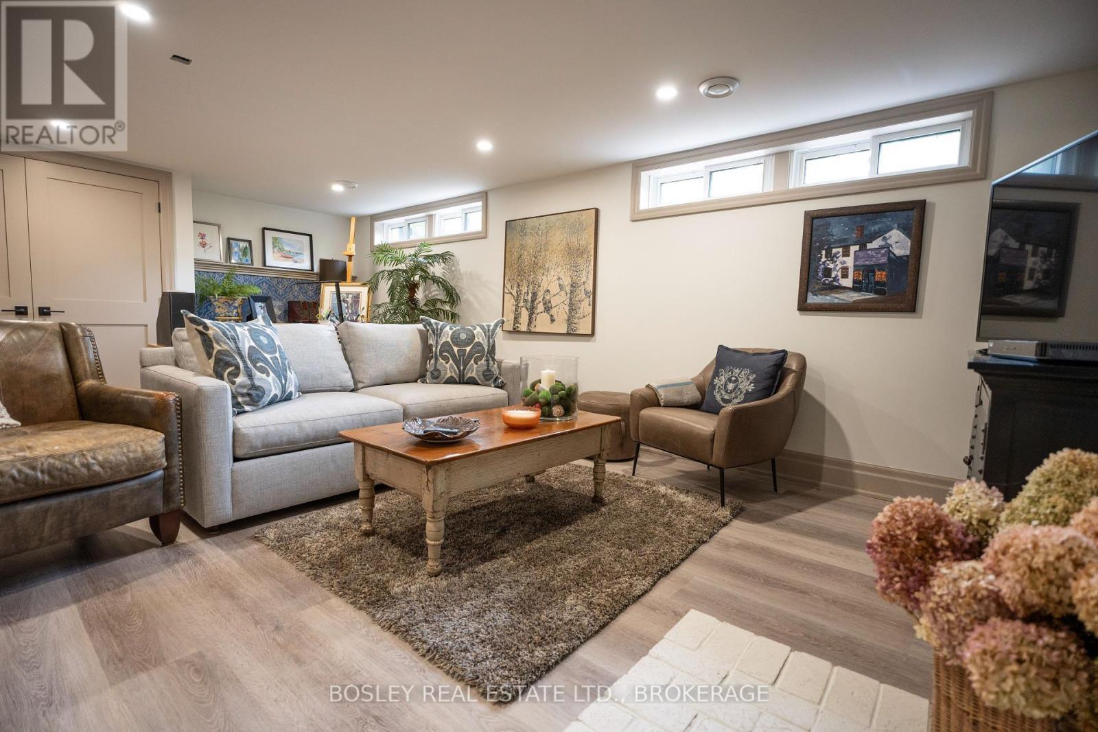 WITH A WALK UP / WALK DOWN FROM THE GARAGE - 14796 Niagara River Parkway, Niagara-On-The-Lake (Rural), ON - Indoor Photo Showing Living Room