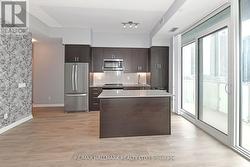 Spacious Kitchen W Centre Island & W/O To Balcony -
