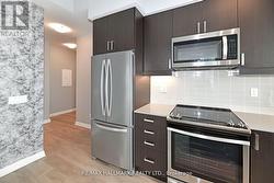 Spacious Kitchen W Centre Island & W/O To Balcony -