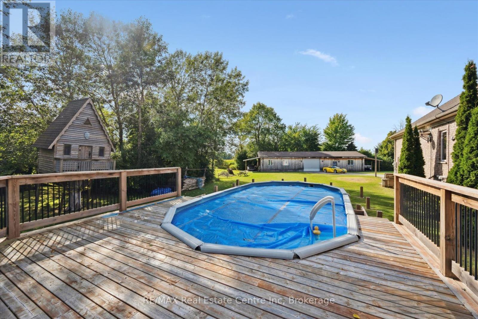 5946 Wellington Rd 86 Road, Woolwich, ON - Outdoor With Above Ground Pool With Deck Patio Veranda With Backyard