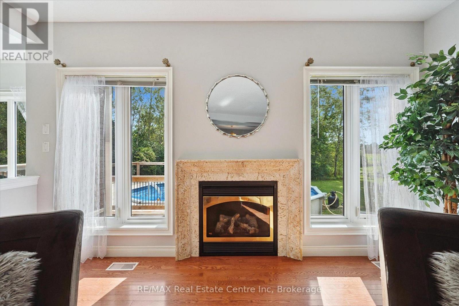 5946 Wellington Rd 86 Road, Woolwich, ON - Indoor Photo Showing Living Room With Fireplace