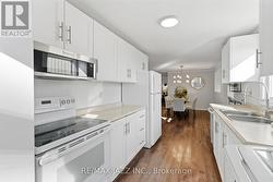 Convenient Galley Kitchen with Ample Cabinets -