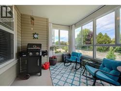 Sunroom off the Living Room with 3 screened windows to invite the outdoors in! -