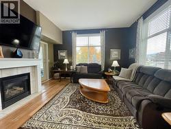 Sunroom off the Living Room with 3 screened windows to invite the outdoors in! -