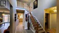 FOYER OPEN TO ABOVE WITH SKYLITE WINDOW -
