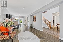 FORMAL LIVING ROOM WITH NEW LAMINATE FLOORING -