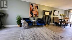 FORMAL LIVING ROOM WITH NEW LAMINATE FLOORING -