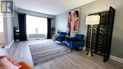 FORMAL LIVING ROOM WITH NEW LAMINATE FLOORING -