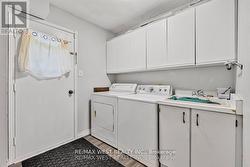 MAIN FLOOR LAUNDRY ROOM WITH SIDE YARD ACCESS -