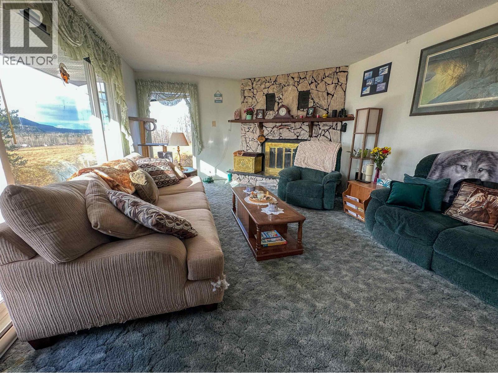 21900 E 16 Highway, Fort Fraser, BC - Indoor Photo Showing Living Room With Fireplace