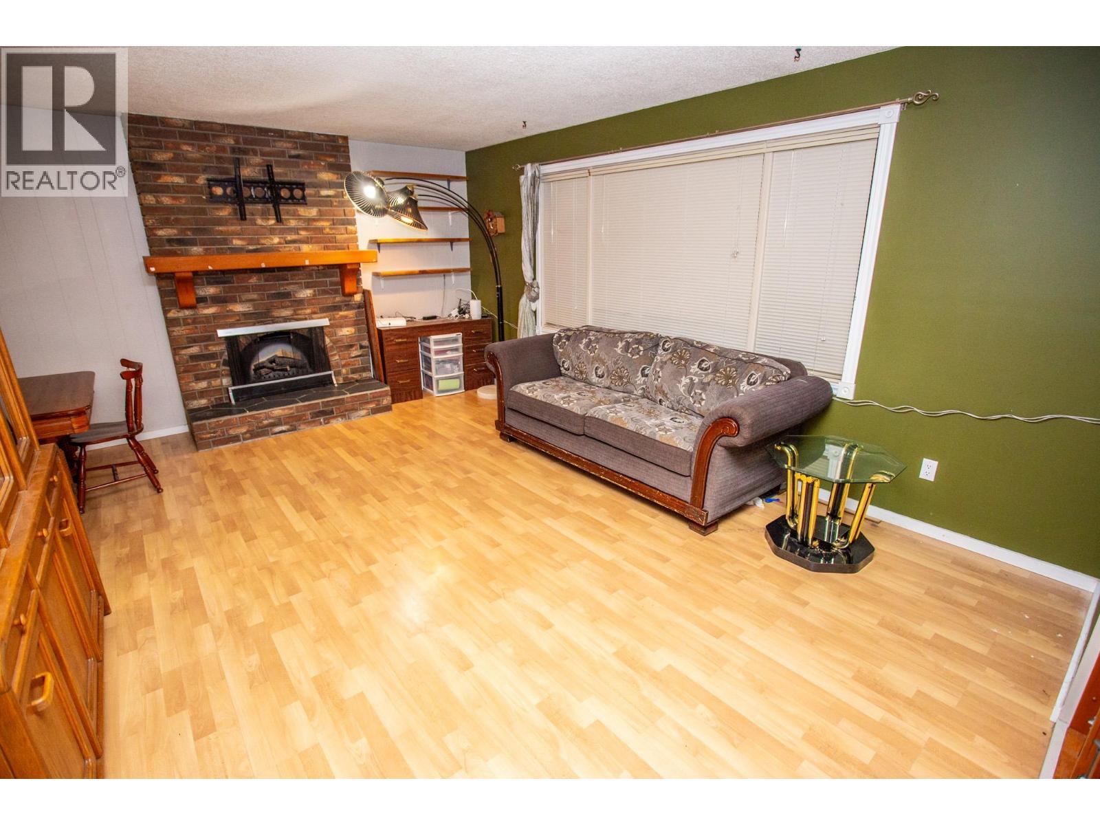 7386 Imperial Place, Prince George, BC - Indoor Photo Showing Living Room With Fireplace