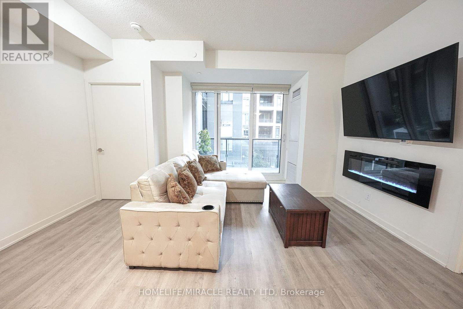 705 - 8119 Birchmount Road, Markham, ON - Indoor Photo Showing Living Room With Fireplace