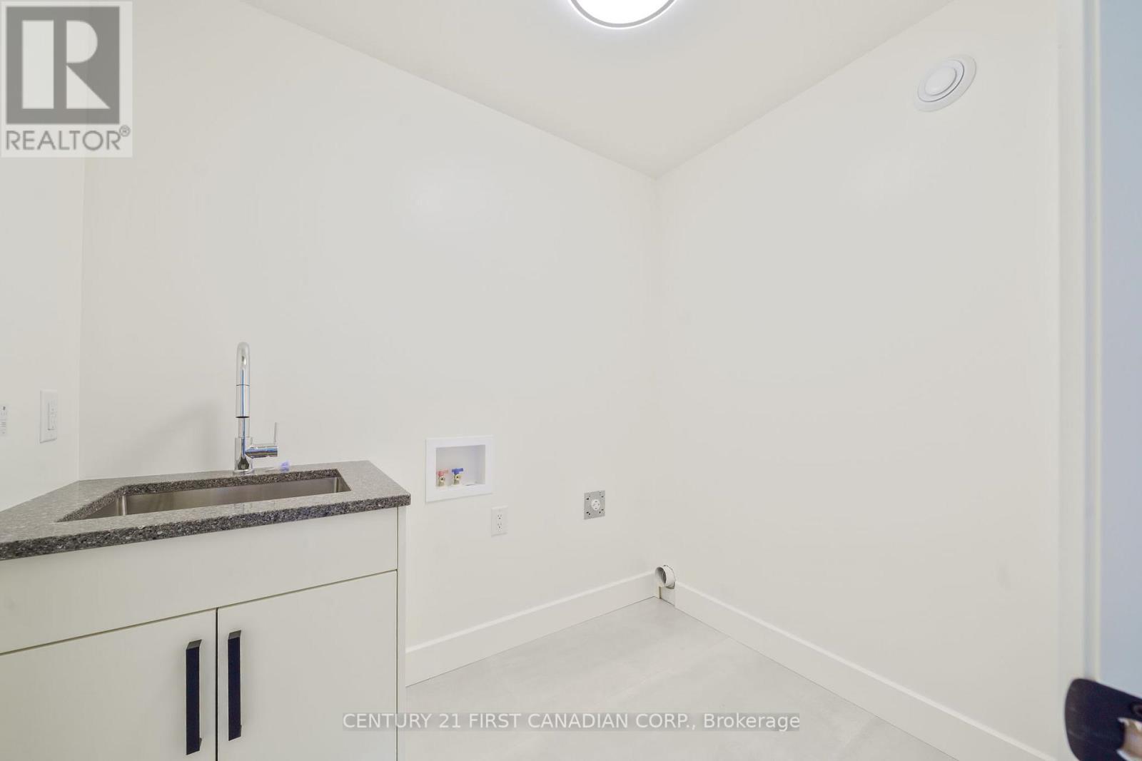 Upper Level Laundry - 105 Sheldabren Street, North Middlesex (Ailsa Craig), ON - Indoor Photo Showing Other Room