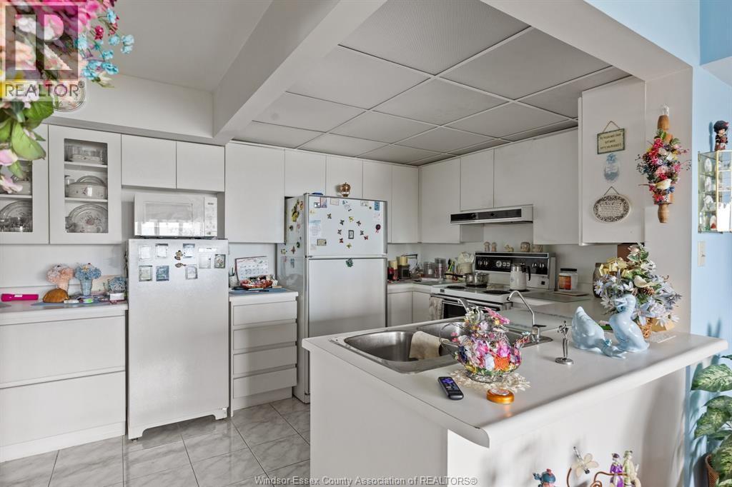 3601 Riverside East Unit# 1203, Windsor, ON - Indoor Photo Showing Kitchen With Double Sink