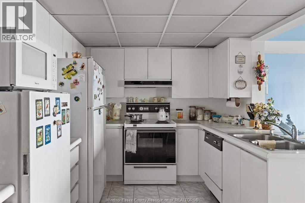 3601 Riverside East Unit# 1203, Windsor, ON - Indoor Photo Showing Kitchen With Double Sink