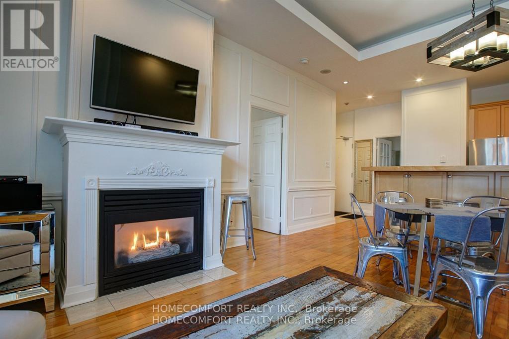 701 - 8 Wellesley Street E, Toronto, ON - Indoor Photo Showing Living Room With Fireplace