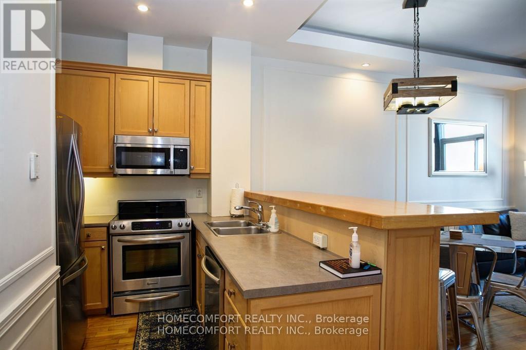 701 - 8 Wellesley Street E, Toronto, ON - Indoor Photo Showing Kitchen With Double Sink