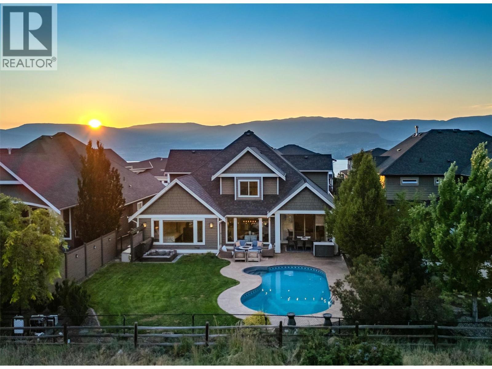Amazing outdoor living overlooking protected parkland...pool, hot tub & covered lounge area. - 425 Audubon Court, Kelowna, BC - Outdoor With In Ground Pool With Deck Patio Veranda