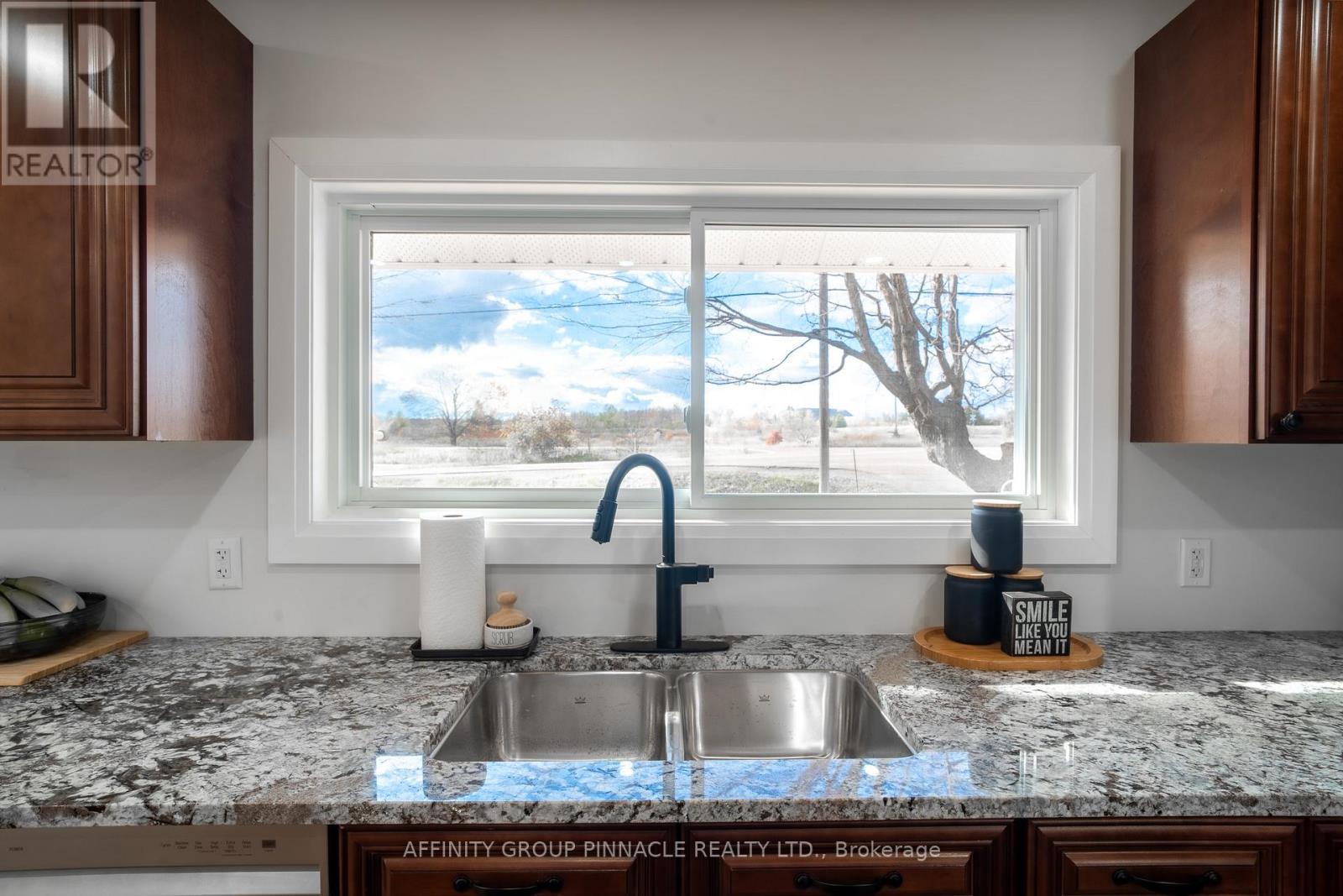 Window overlooking Front Yard - 1651 Ramara Road 51, Ramara (Brechin), ON - Indoor Photo Showing Kitchen With Double Sink With Upgraded Kitchen