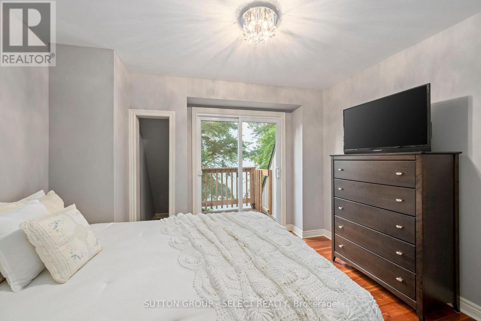 Second bedroom with balcony - 5284 Cliff Road, Lambton Shores (Forest), ON - Indoor Photo Showing Bedroom