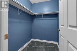 Primary bedroom walk in closet -