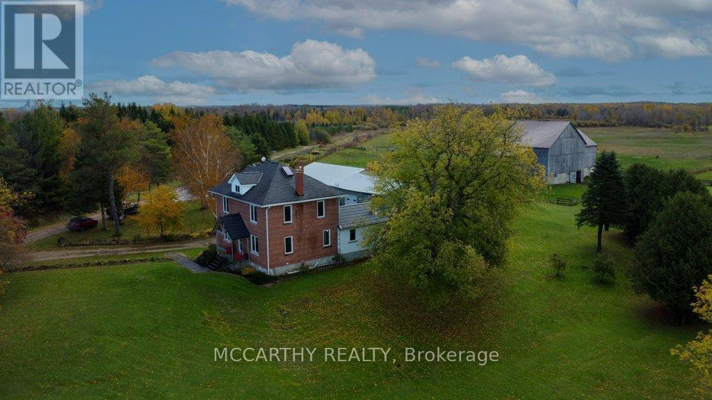 drone shot of house and barn - 713630 Durham Road B, Grey Highlands, ON