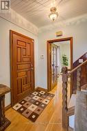 Original wood trim and wooden stair rail -