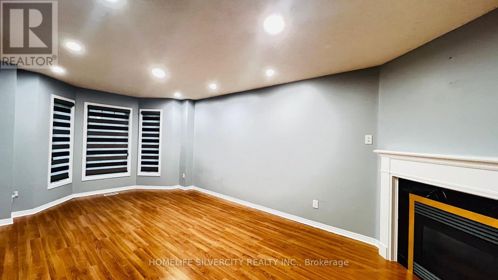 7 Bison Run Road, Brampton, ON - Indoor Photo Showing Other Room With Fireplace