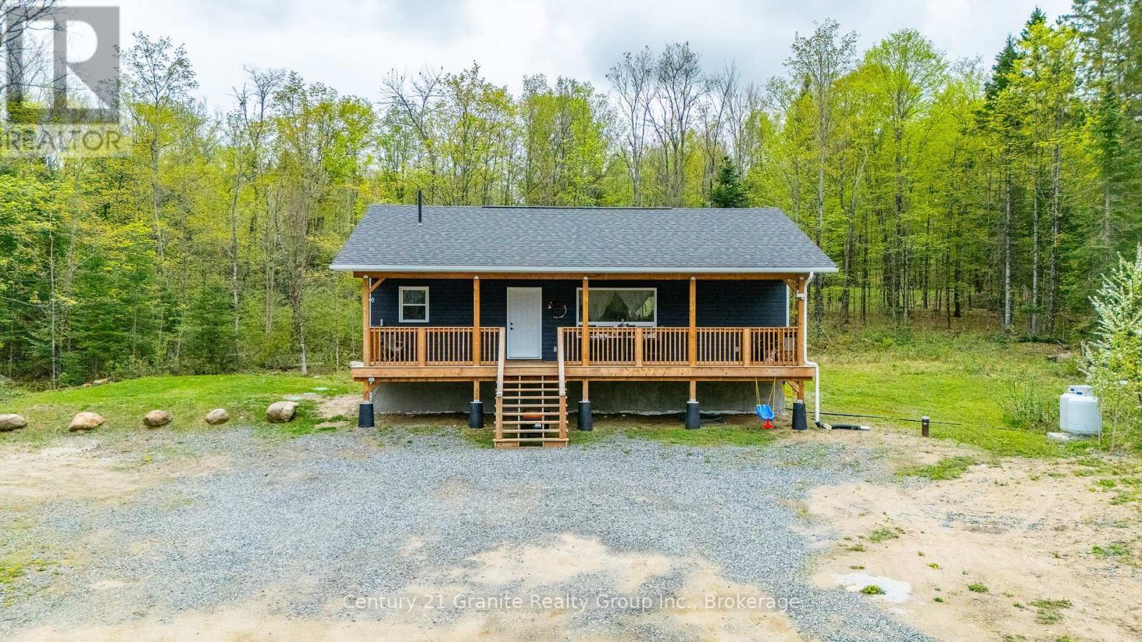 10498 Highway 118, Algonquin Highlands (Stanhope), ON - Outdoor With Deck Patio Veranda
