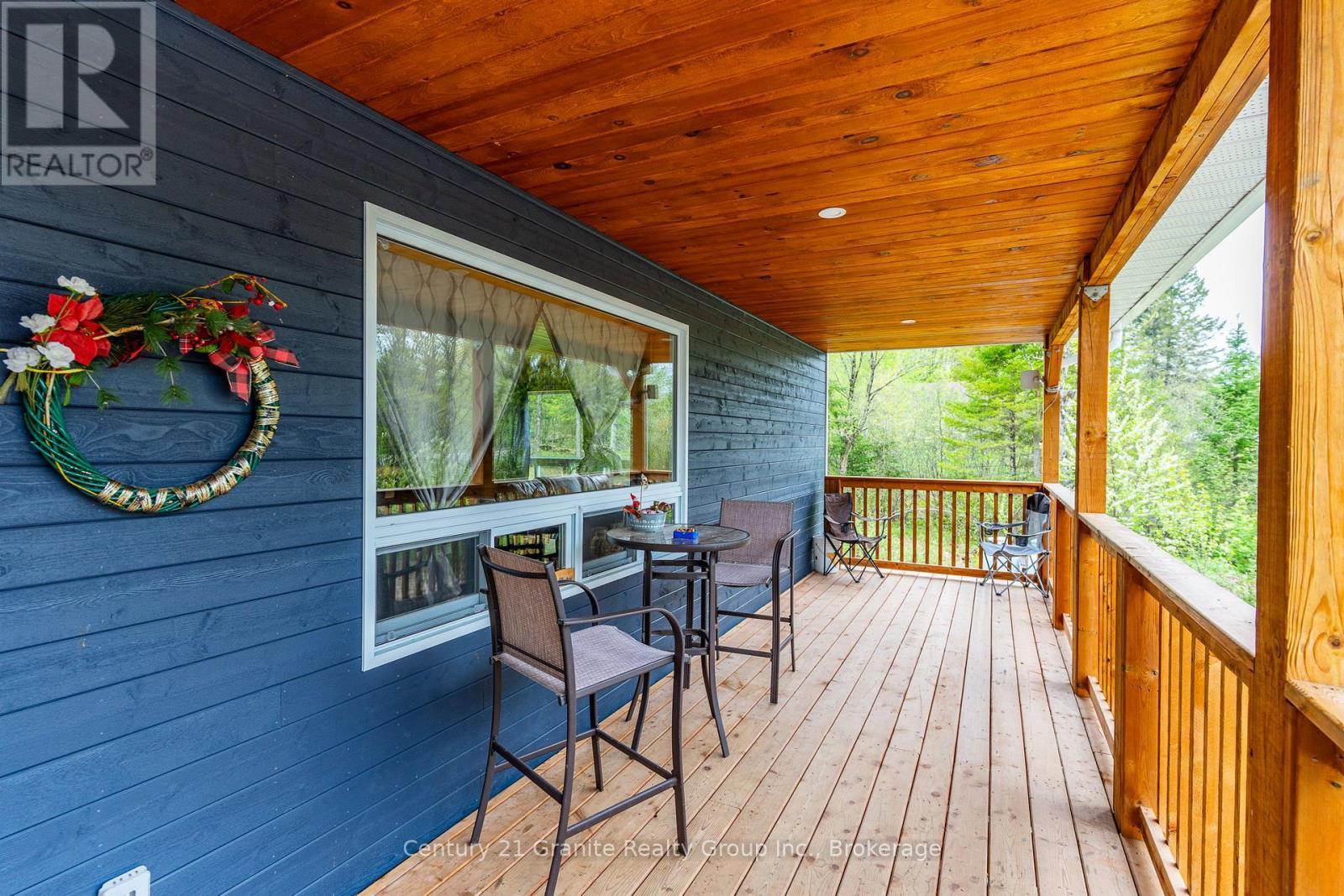 10498 Highway 118, Algonquin Highlands (Stanhope), ON - Outdoor With Deck Patio Veranda With Exterior