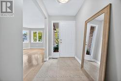 Spacious foyer with new tile -