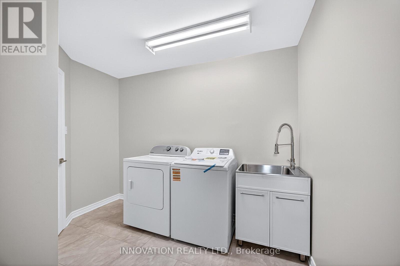 New washer & wash tub, dryer less than a year old - 30 Randall James Drive, Ottawa, ON - Indoor Photo Showing Laundry Room