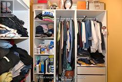 Primary Bedroom W/I Closet W B/I Shelves&Drawers -