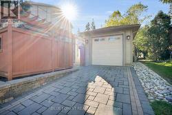 2nd driveway with deep garage -