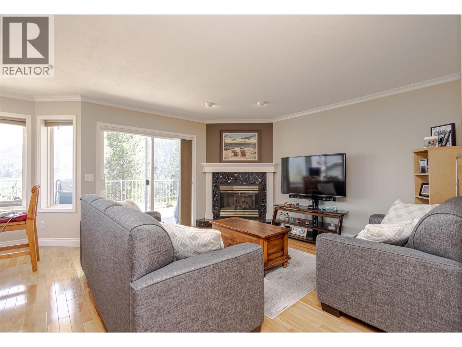 5291 Bradbury Street, Peachland, BC - Indoor Photo Showing Living Room With Fireplace