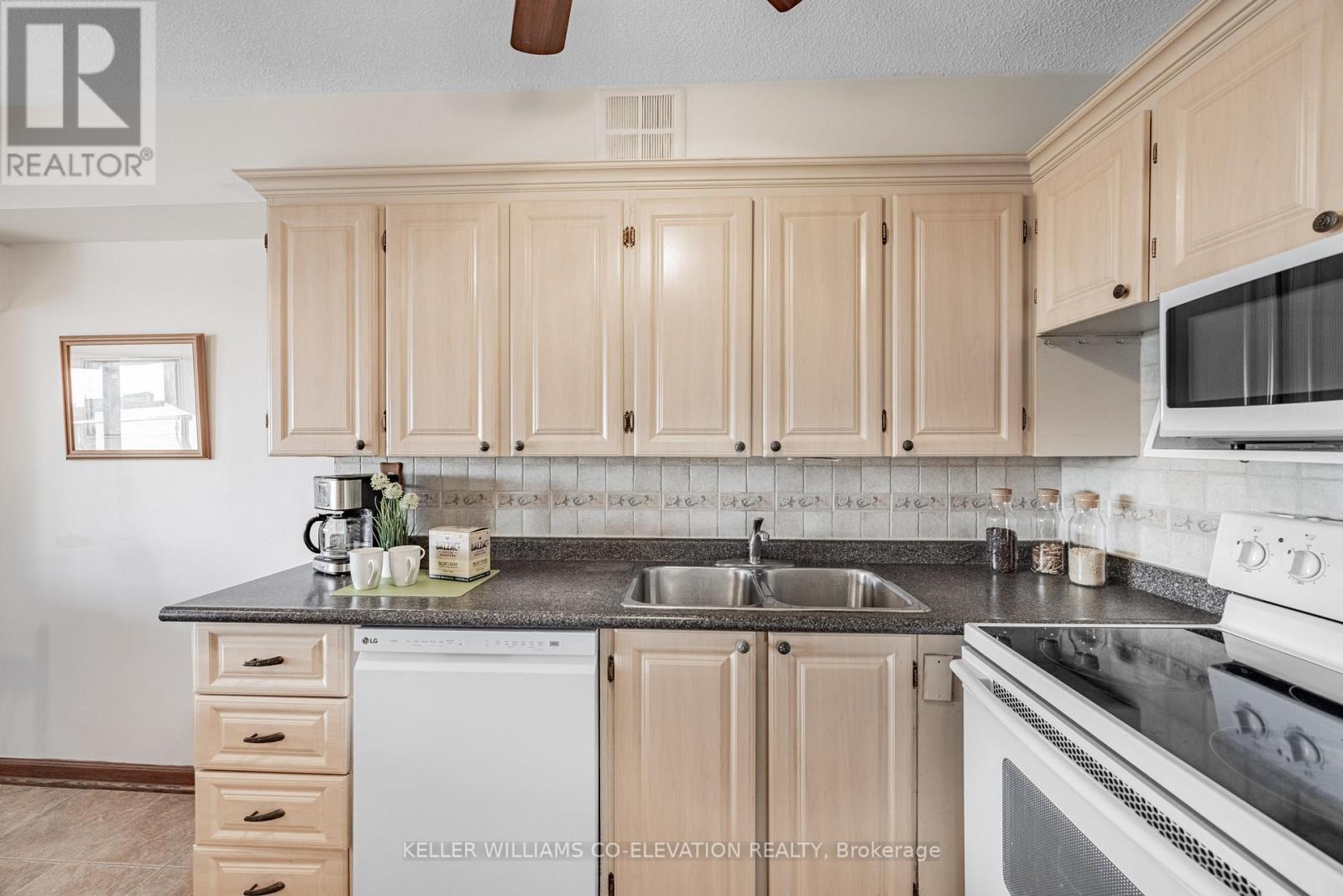 Loads Of Storage & Prep Space - 1306 - 260 Scarlett Road, Toronto, ON - Indoor Photo Showing Kitchen With Double Sink