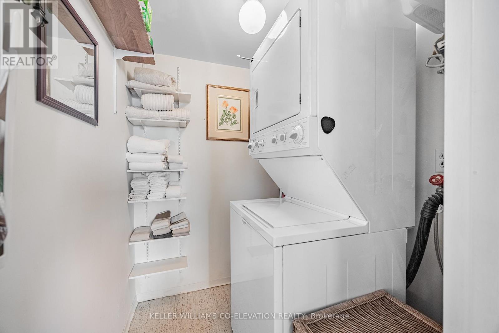 Ensuite Laundry Room With Storage - 1306 - 260 Scarlett Road, Toronto, ON - Indoor Photo Showing Laundry Room