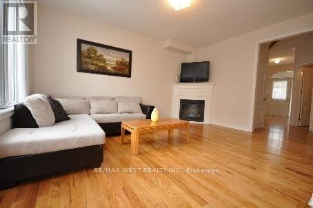 571 Vellore Woods Boulevard, Vaughan, ON - Indoor Photo Showing Living Room With Fireplace