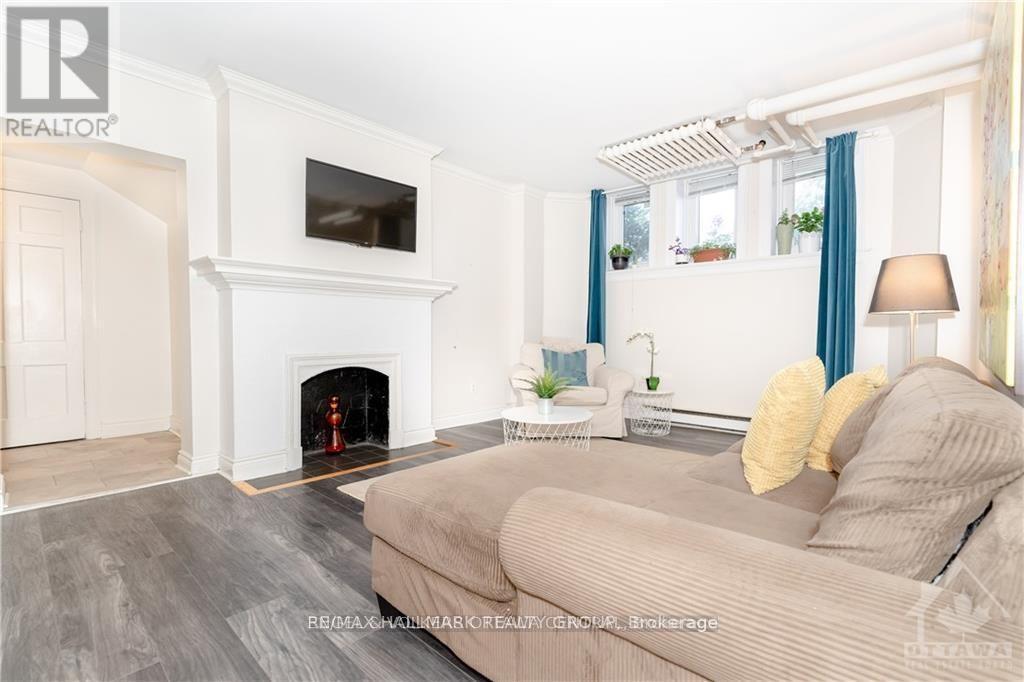 1A - 180 Augusta Street, Ottawa, ON - Indoor Photo Showing Living Room With Fireplace
