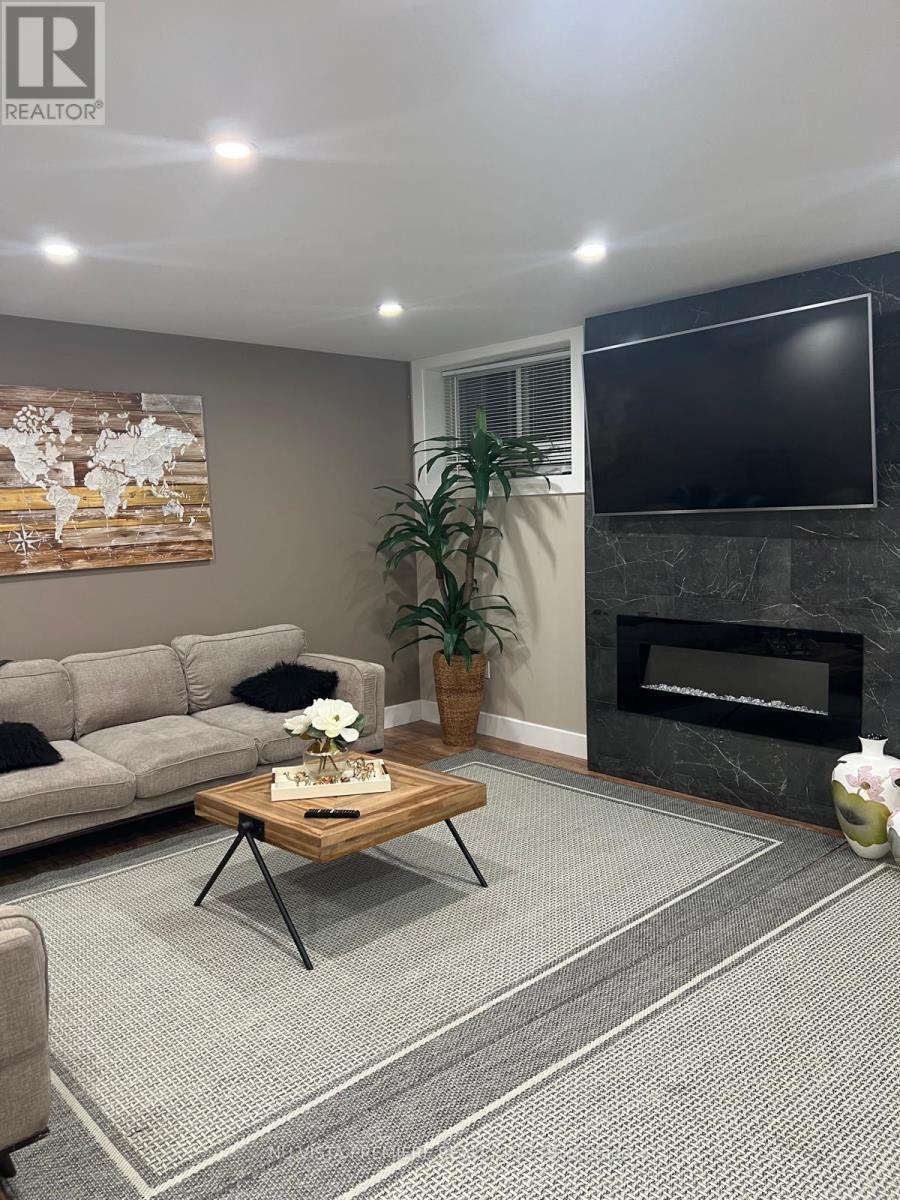 Lower Level - 1807 Brunson Way, London South (South K), ON - Indoor Photo Showing Living Room With Fireplace