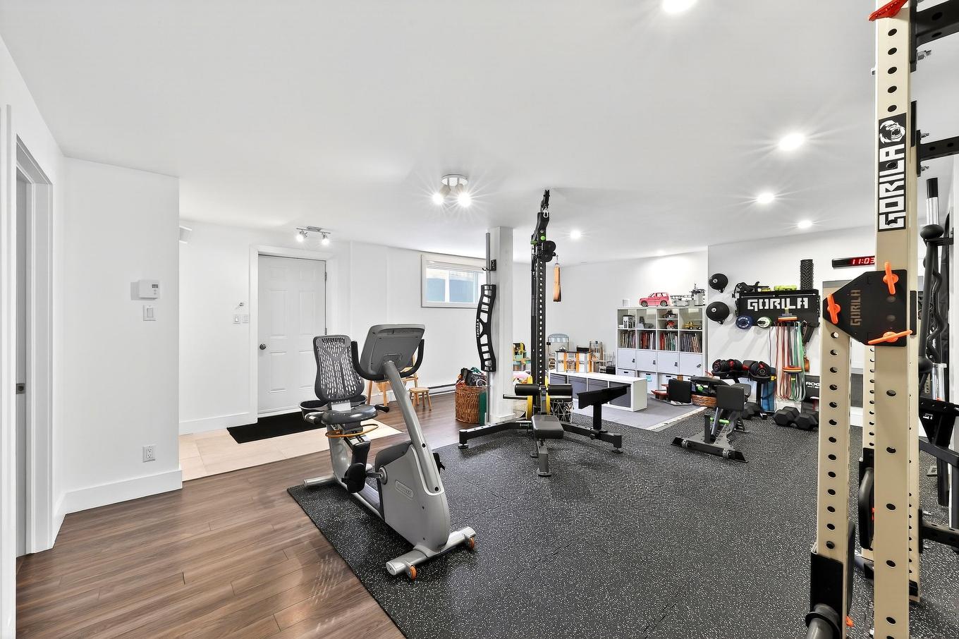 Family room - 12115 Rue Paul-Sauvé, Mirabel, QC - Indoor Photo Showing Gym Room