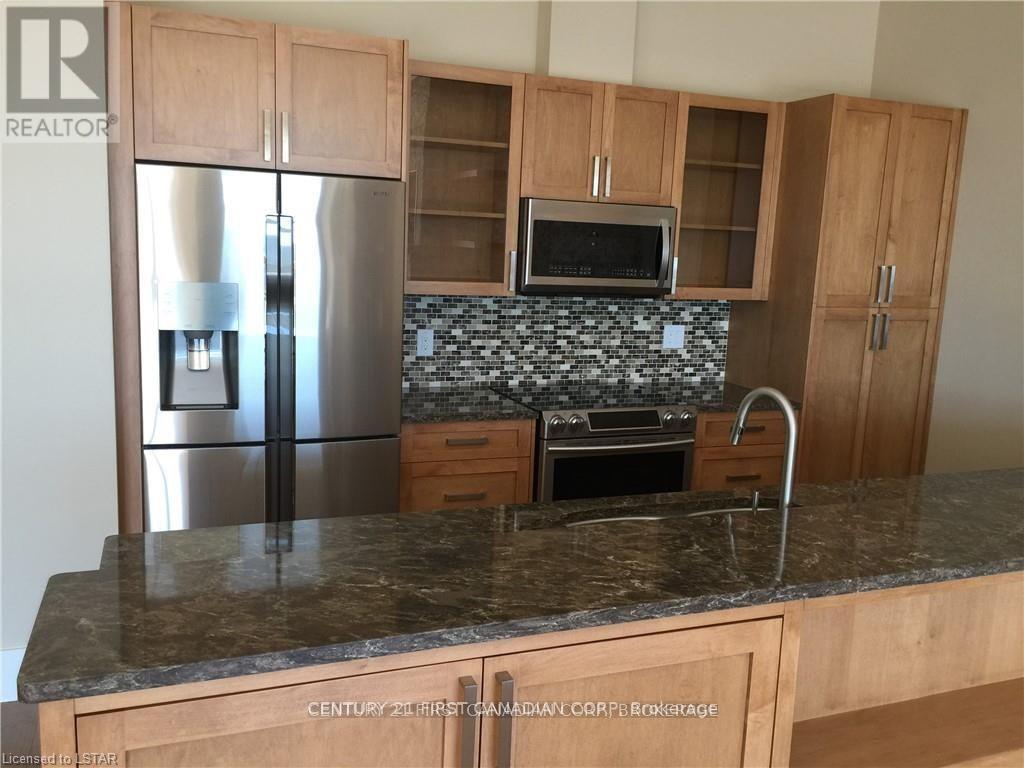 411 - 1705 Fiddlehead Place, London North (North R), ON - Indoor Photo Showing Kitchen With Upgraded Kitchen