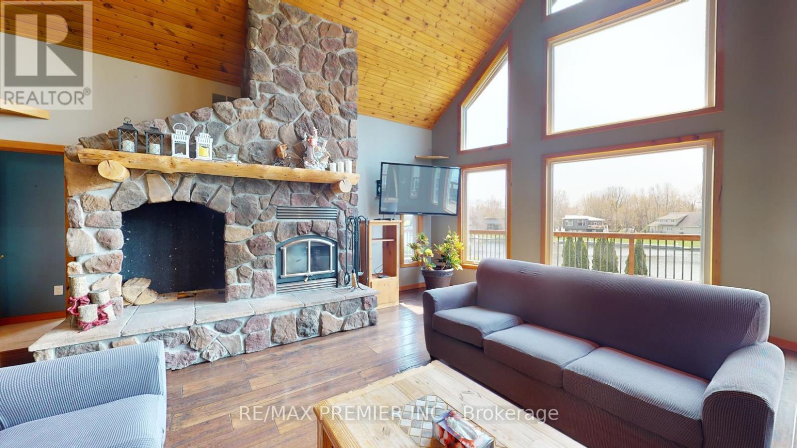 31 Paradise Boulevard, Ramara, ON - Indoor Photo Showing Living Room With Fireplace