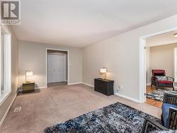 Spacious Living room facing front yard. -