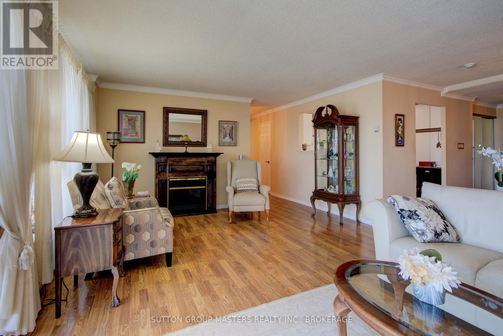 1004 - 257 Bath Road, Kingston (West Of Sir John A. Blvd), ON - Indoor Photo Showing Living Room With Fireplace