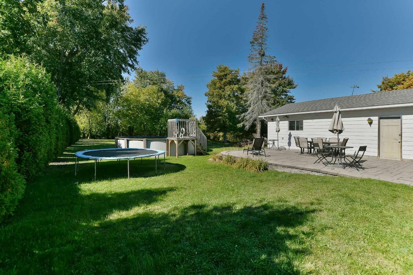 Backyard - 84 Rue Onulphe-Peltier, L'Épiphanie, QC - Outdoor With Deck Patio Veranda